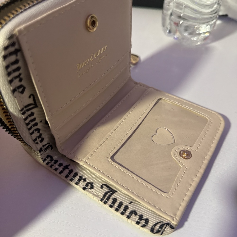 Juicy couture wallet 
Cute wallet that’s  
Fits a lot! 
Brand new